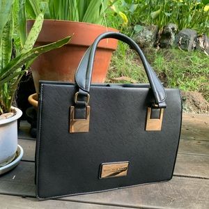 Black handbag by Marc New York, Andrew Marc.